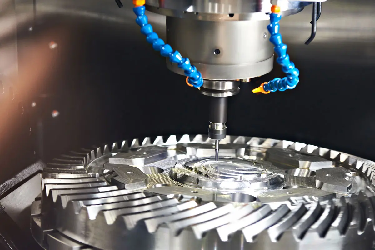 CNC spindle machining a precision metal component with coolant nozzles